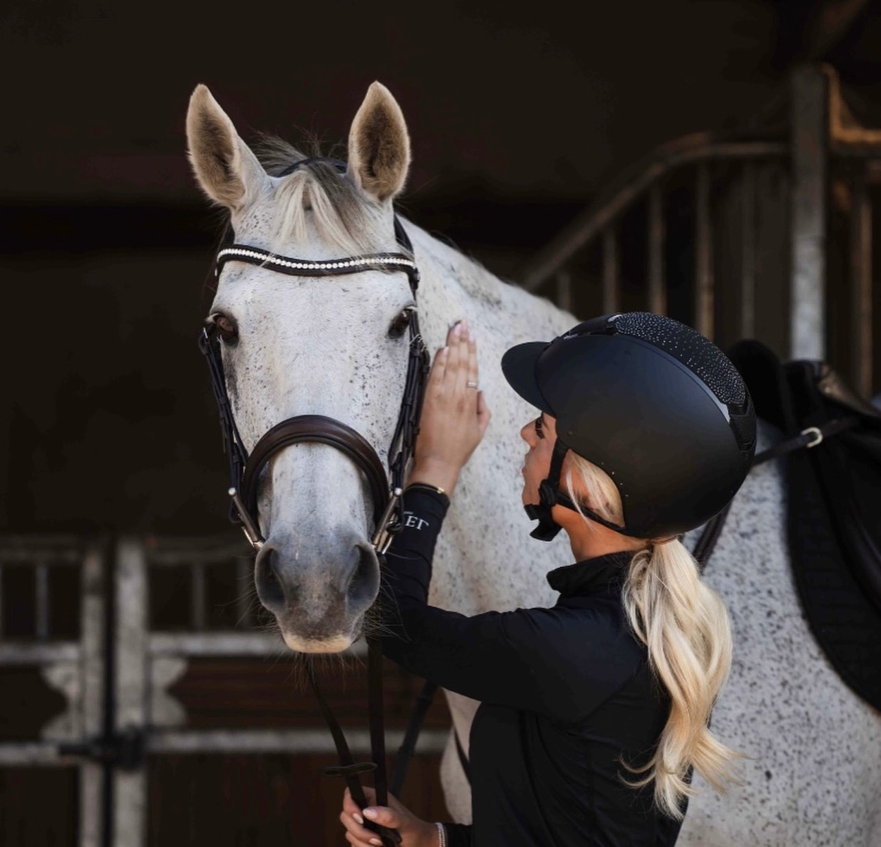 Ellie, founder of Pea's Paws, with her horse